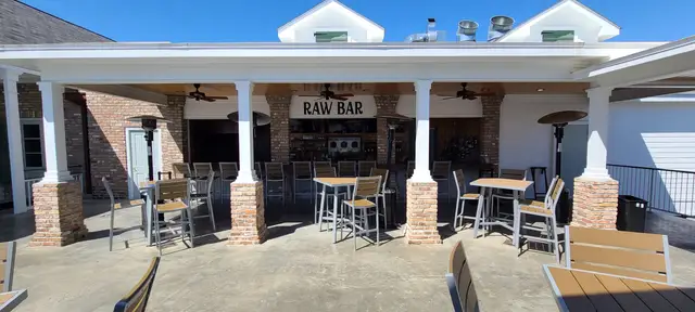 The oyster bar, its brick columns and the raw bar