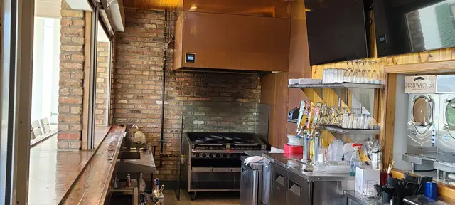 The oyster bar, its brick columns and the raw bar