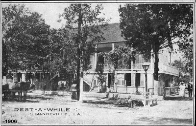 A 1906 black-and-white postcard labeled Rest-A-While, Mandeville, La., showing the hotel from the lakefront