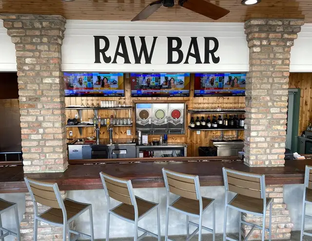 The oyster bar, its brick columns and the raw bar