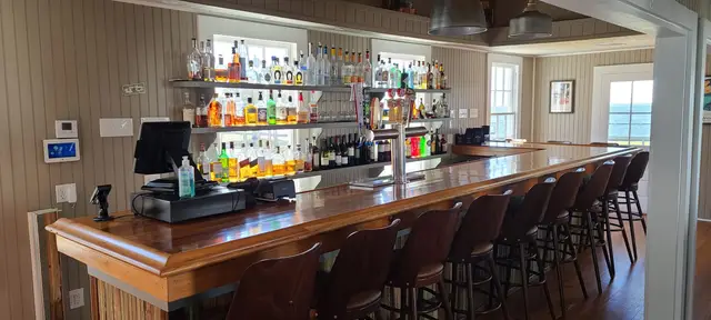 Cocktails and wine in the 1916 Sophie Wright Cottage